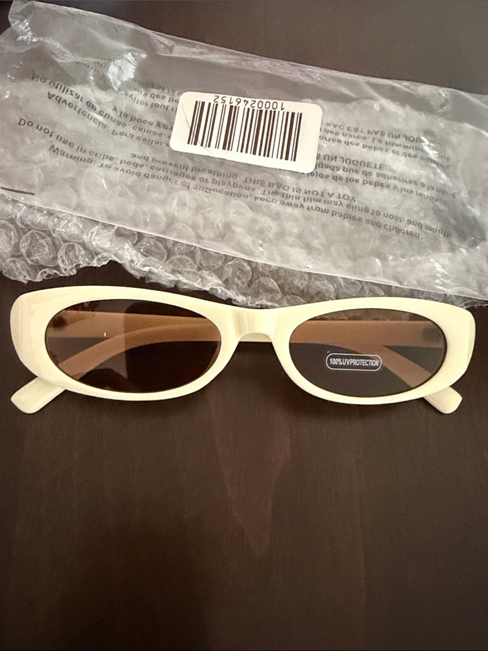 WONDERLAND Cream Oval Sunglasses with Brown Lenses